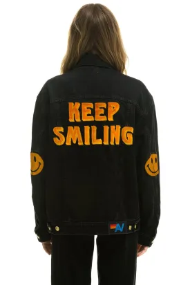 KEEP SMILING OVERSIZED CONCERT DENIM JACKET - VINTAGE BLACK